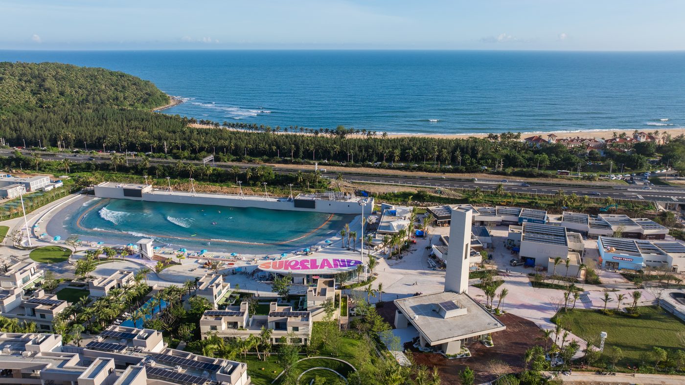 Aerial view of the PerfectSwell wave pool at Riyue Bay on a clear tropical day, Wanning, Hainan